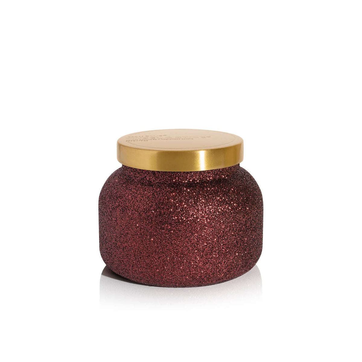 Capri Blue front jar view showing maroon glitter and festive appeal