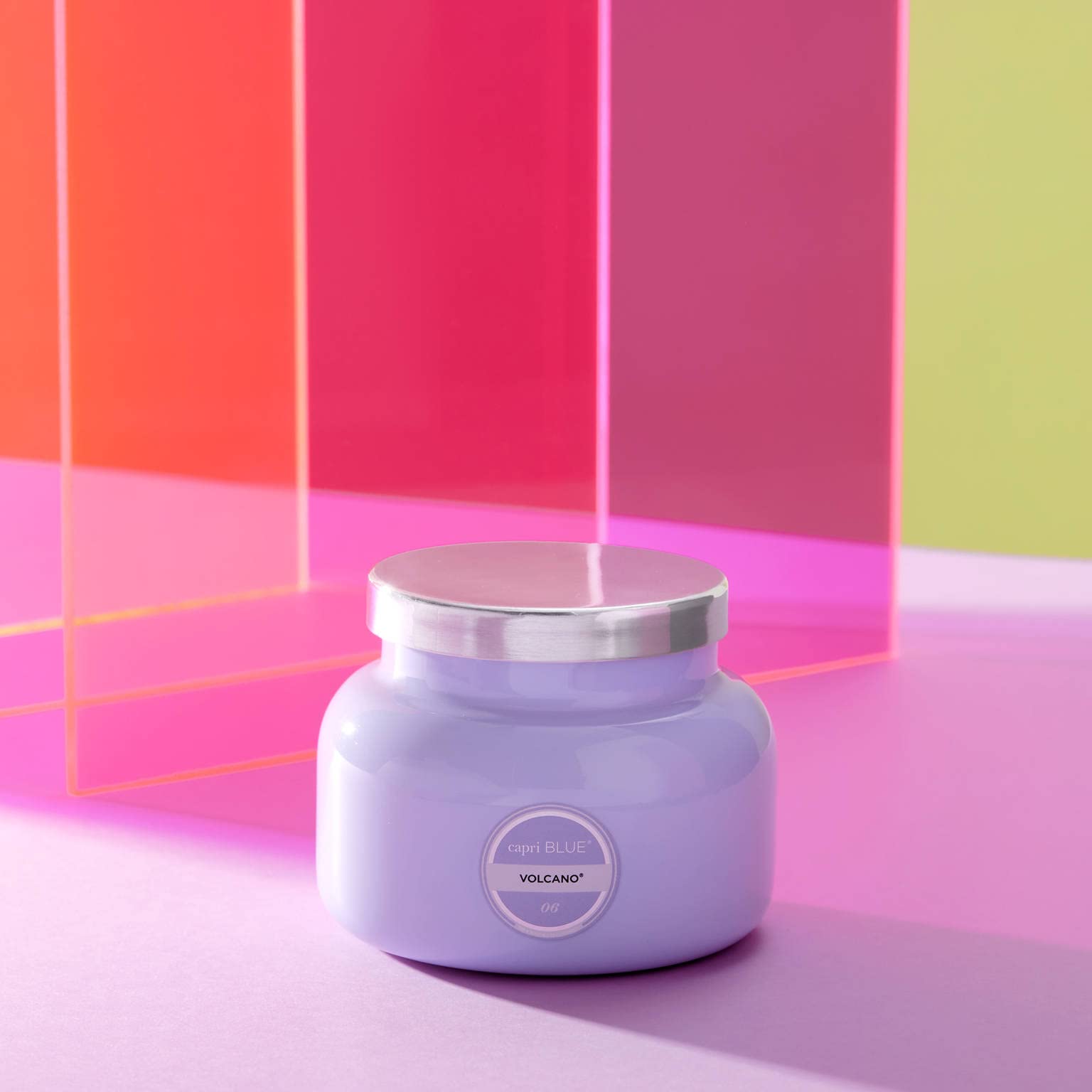 Capri Blue lit Volcano candle emitting warm glow and steady fragrance diffusion