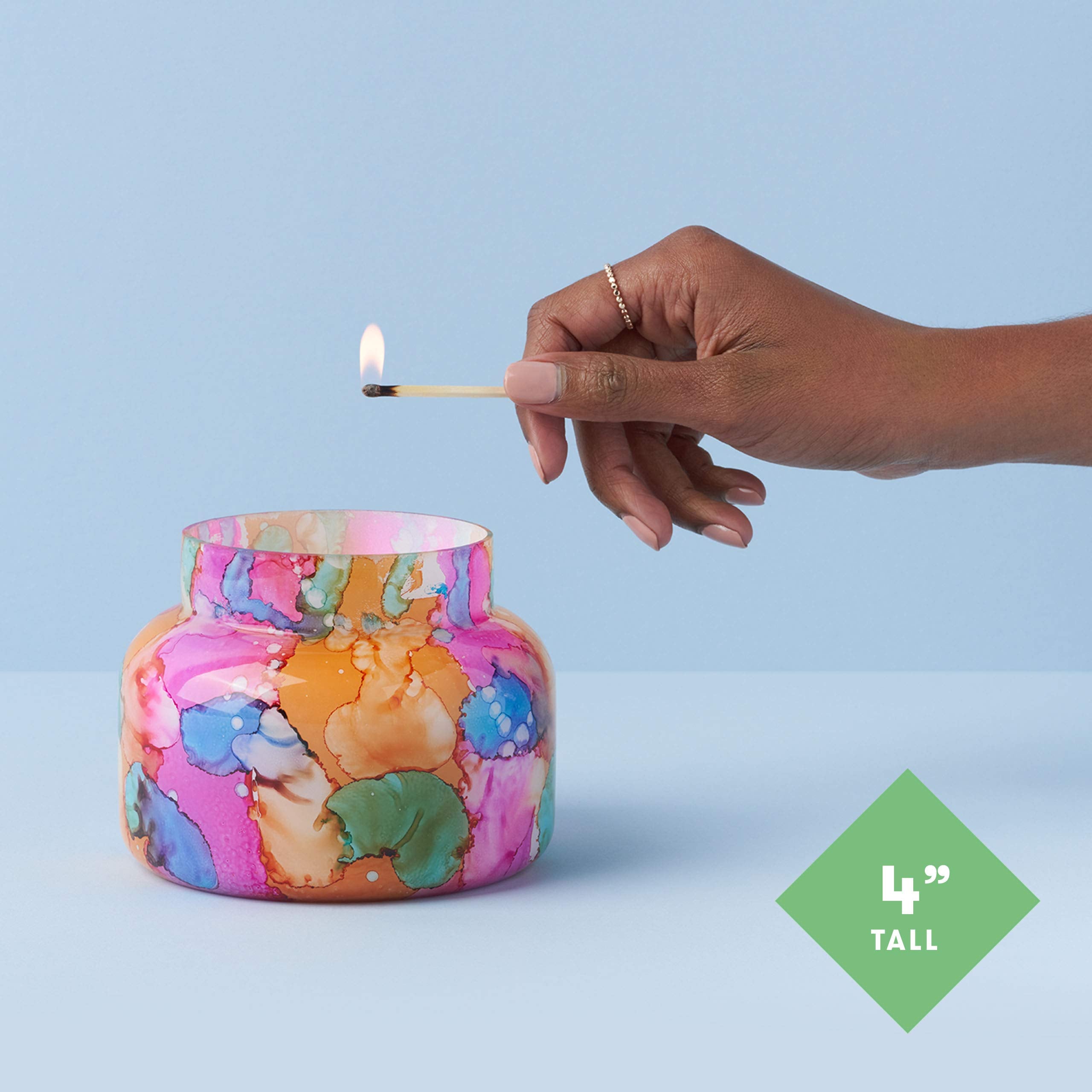 Capri Blue lit candle wax pool and flame demonstrating warm ambiance and steady burn