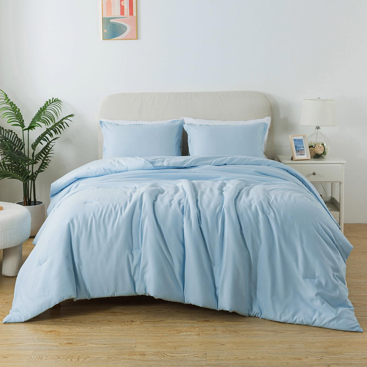 Caressma front packaging showing neat folded twin comforter and calm blue color for easy setup