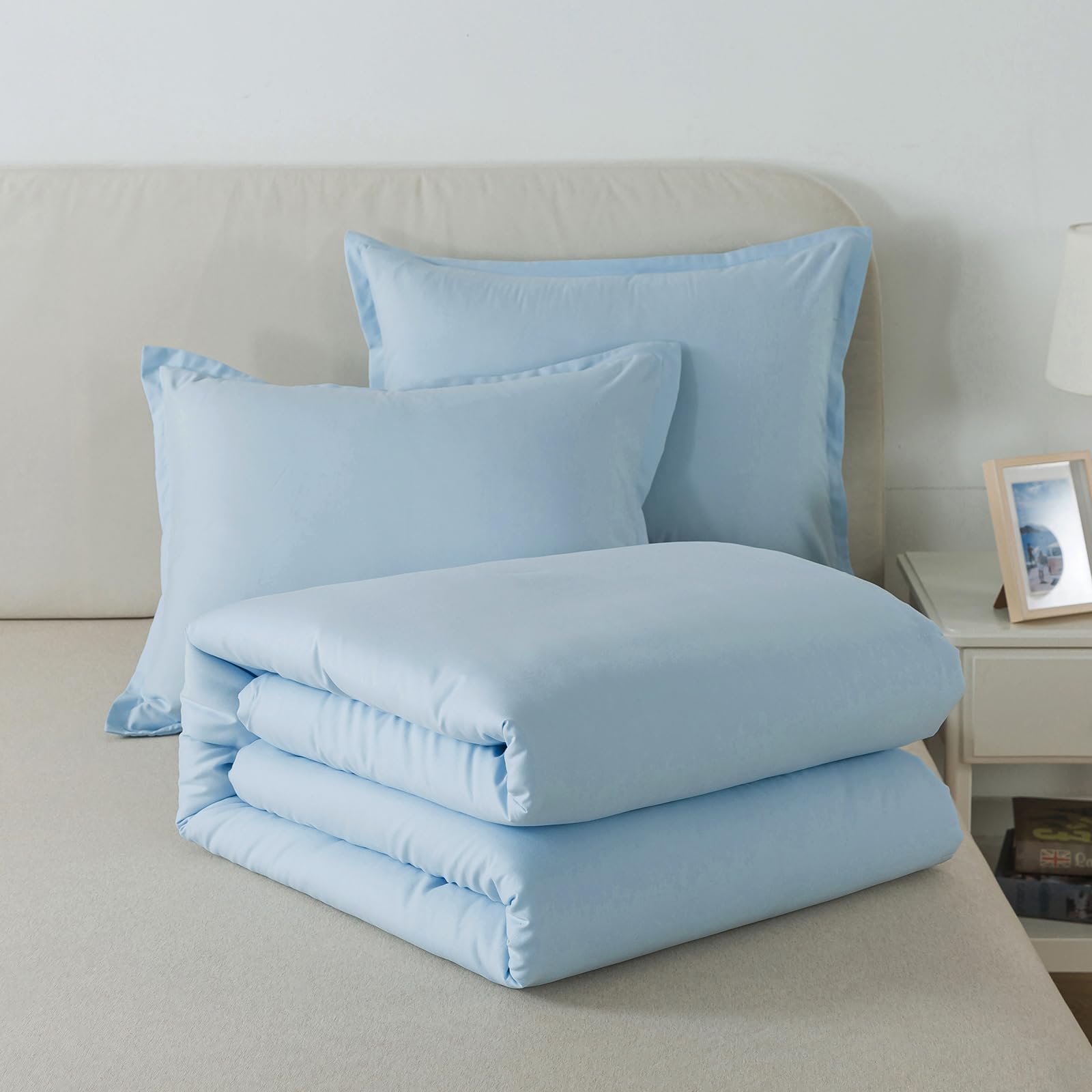 Caressma vacuum-packed comforter being unboxed to show compact shipping and quick fluffing