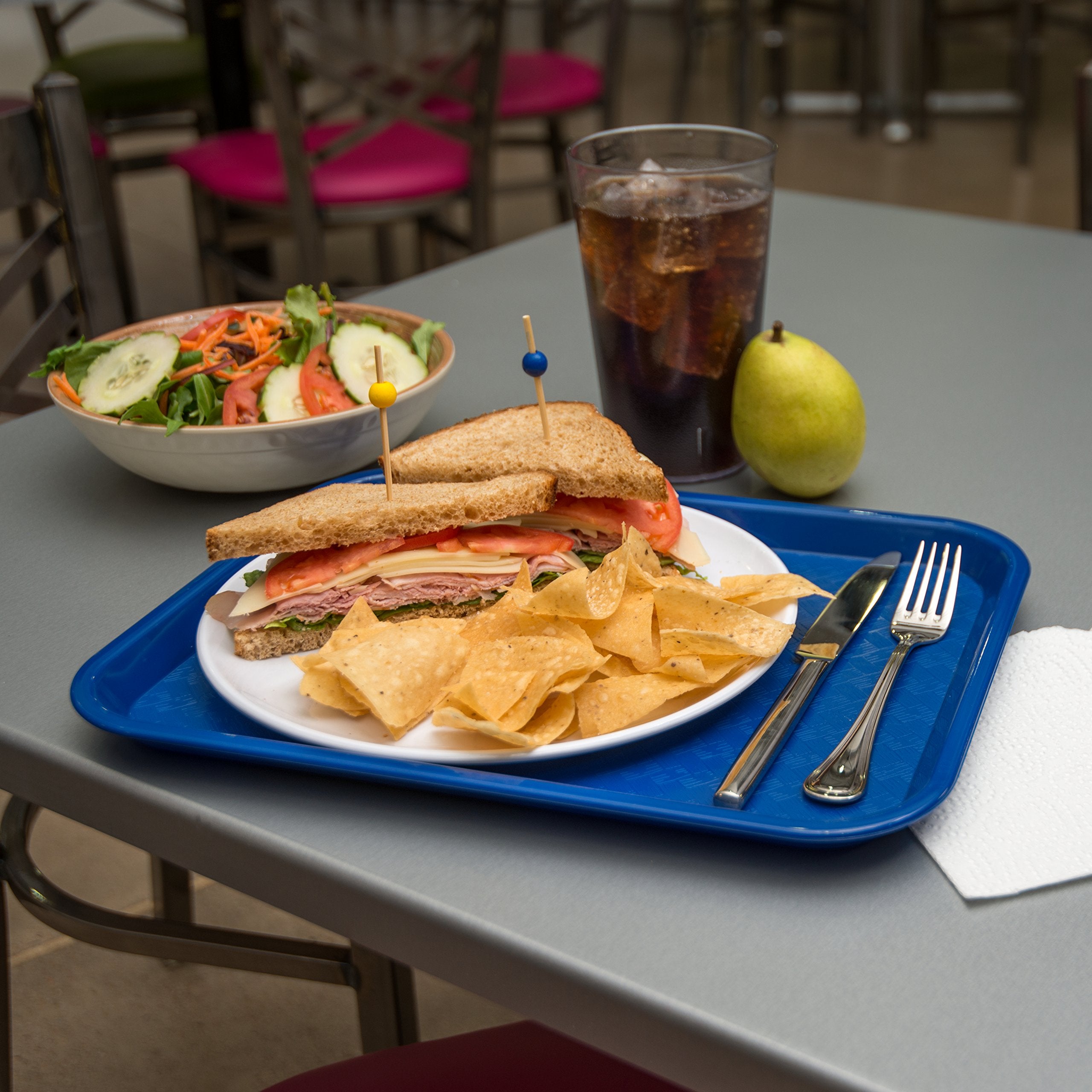 Carlisle tray in use on cafeteria counter reducing slips during transport benefit
