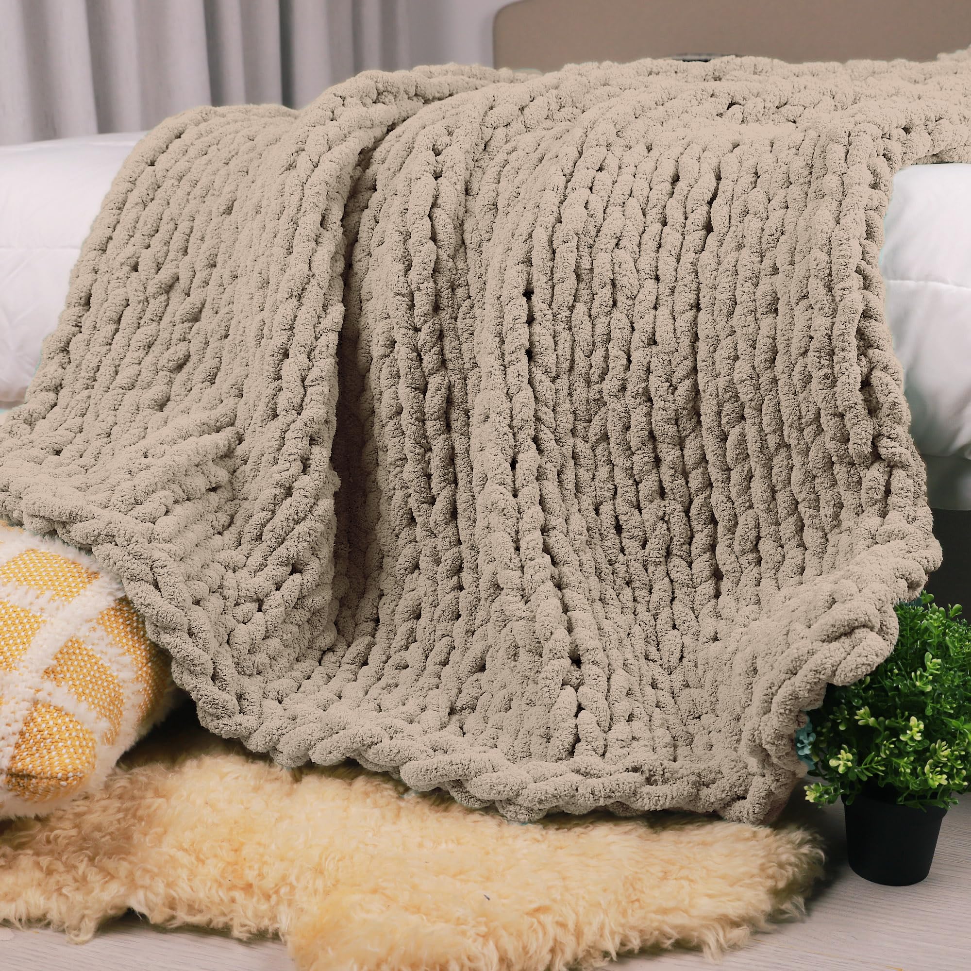 Carriediosa front view of taupe throw showing oversized cozy benefit
