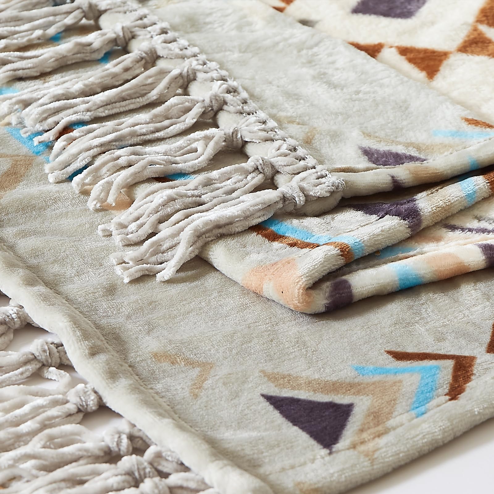 CASAAGUSTO draped over bed demonstrating layered bedroom styling and added comfort