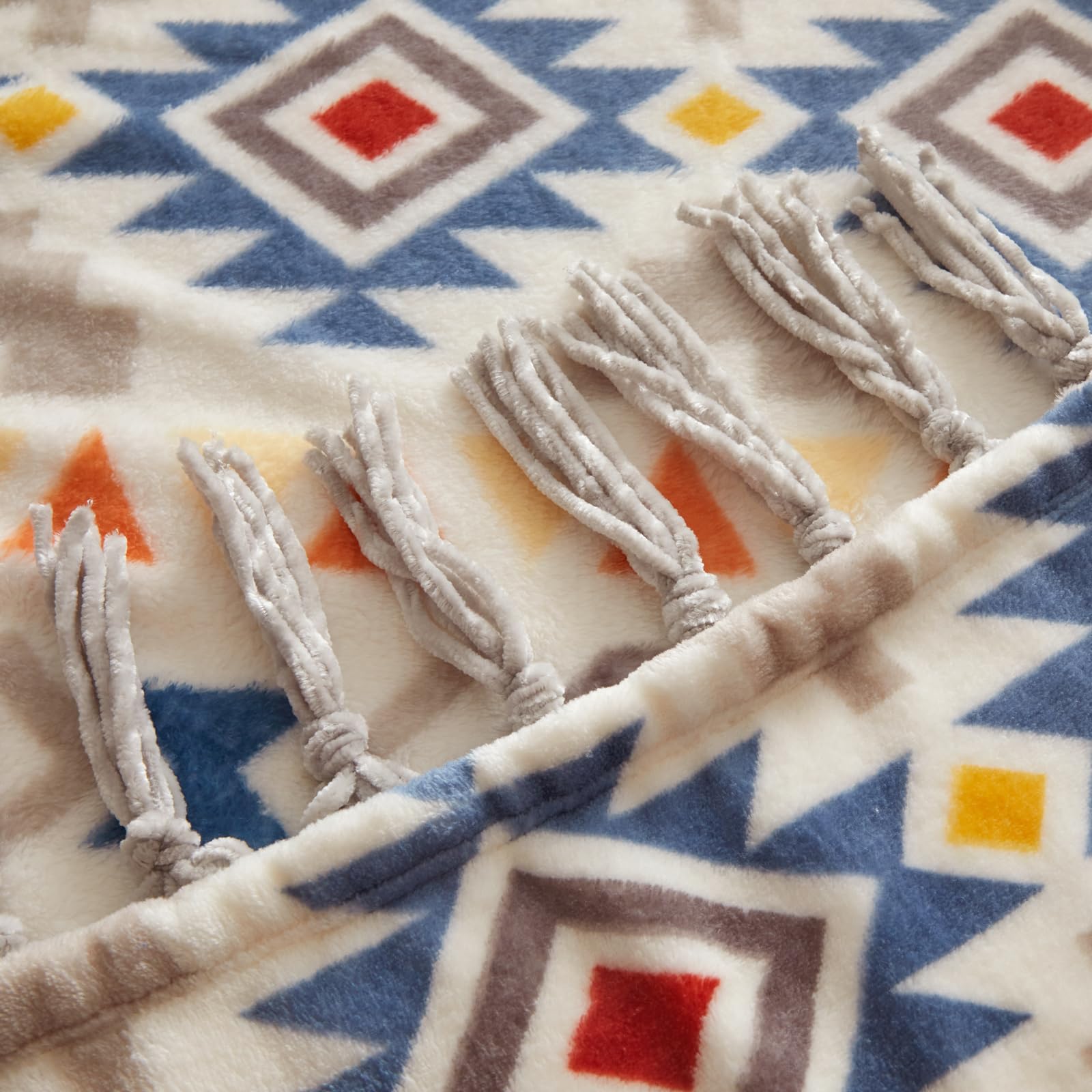 CASAAGUSTO draped over sofa adding warmth and farmhouse boho charm