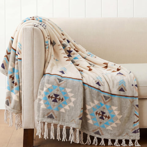 CASAAGUSTO front view of boho tassel throw showing pattern and fringe for instant style