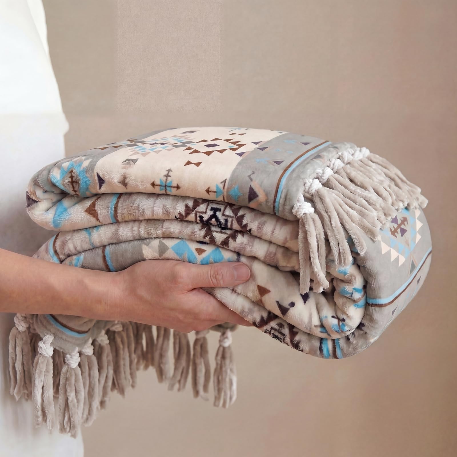 CASAAGUSTO throw styled on a sofa conveying cozy farmhouse-boho living room warmth