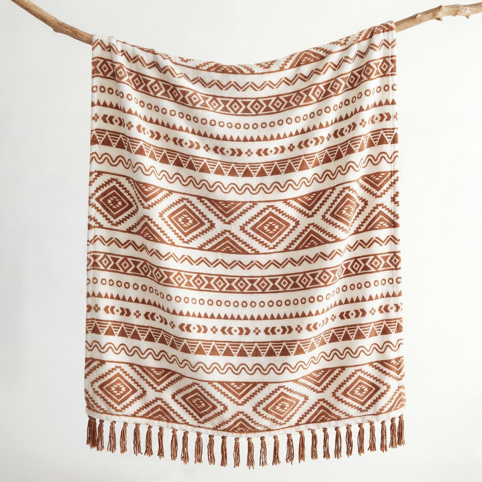 CASAAGUSTO tassel detail close-up highlighting handcrafted look