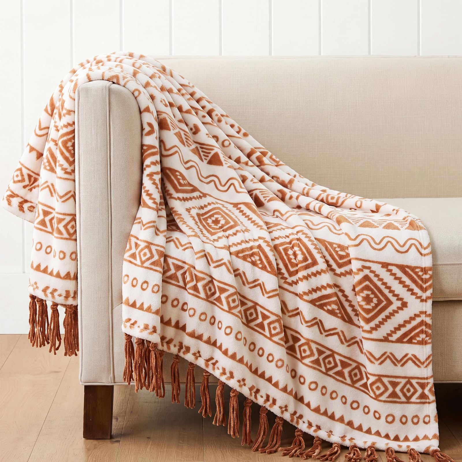 CASAAGUSTO folded terracotta throw showing pattern, adds cozy color