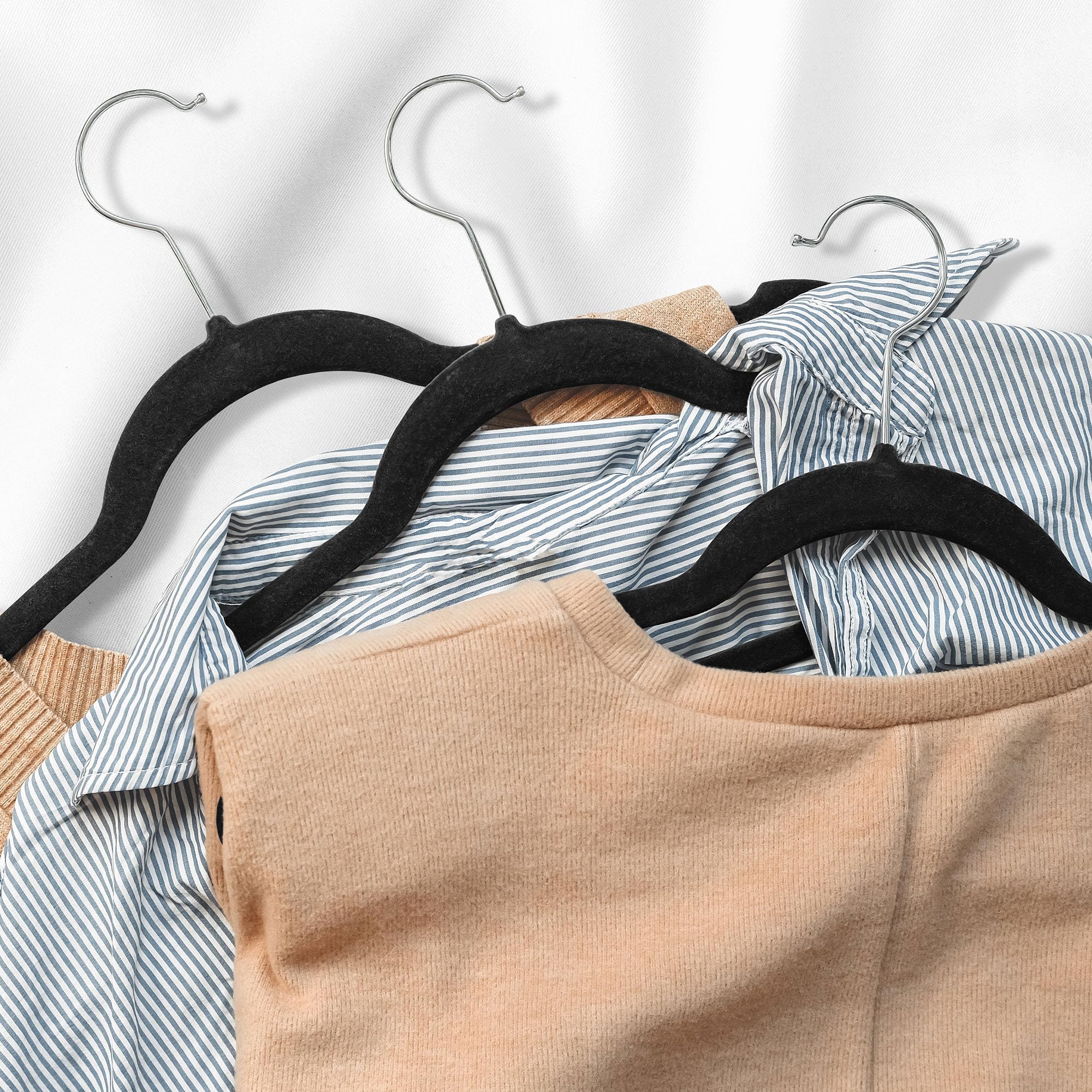 Casafield hanger holding dress, shirt, pants organizes outfits