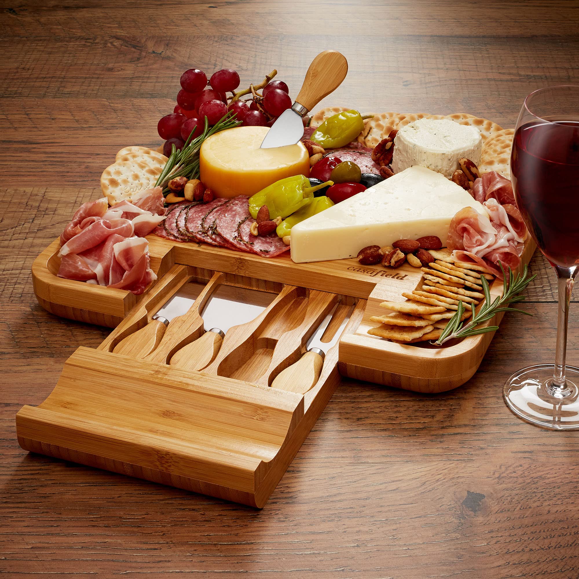 Casafield board beside utensils to show scale and portability for serving small gatherings