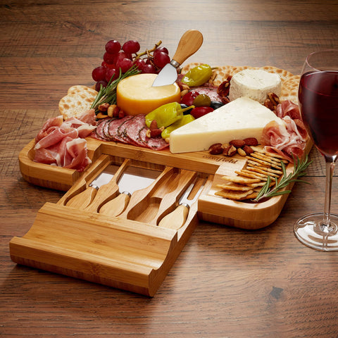 Casafield board beside utensils to show scale and portability for serving small gatherings