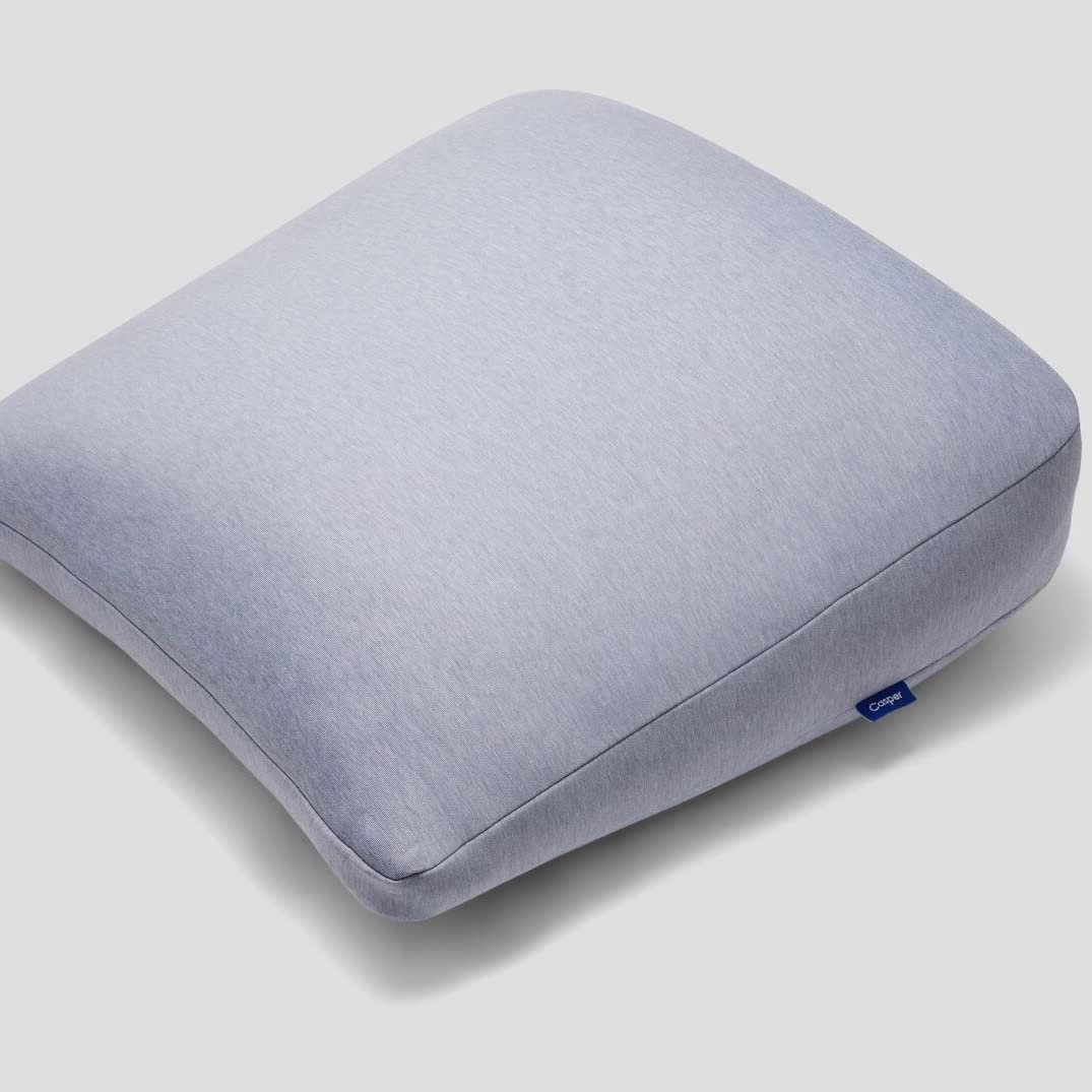 casper full-length gray pillow on bed showing shape and support