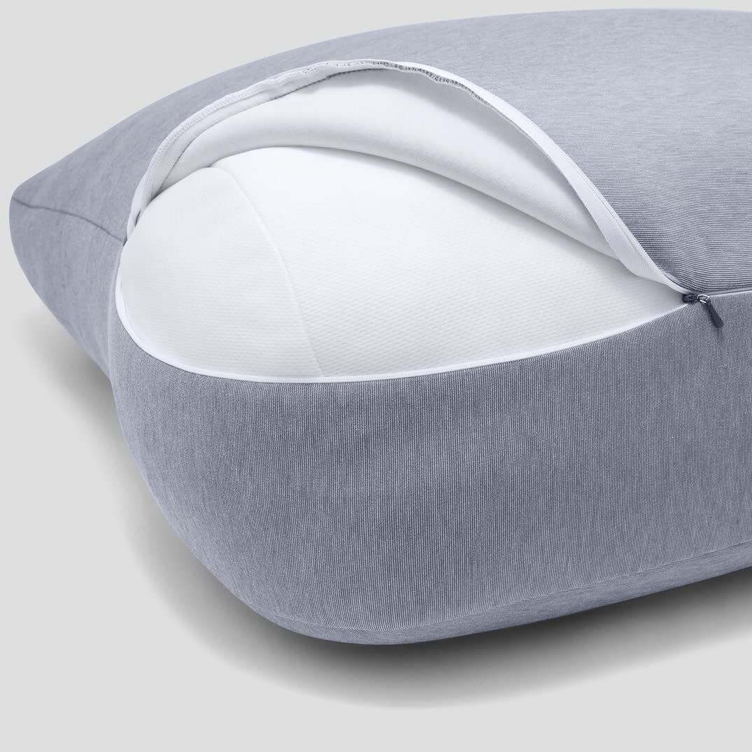 casper pillow next to person showing one-size scale and stability