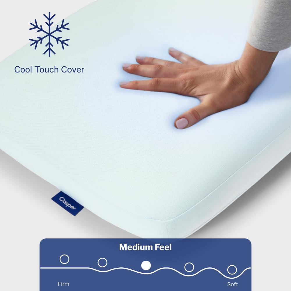 Casper pillow on made bed in bedroom setting illustrating cooler sleep comfort and style