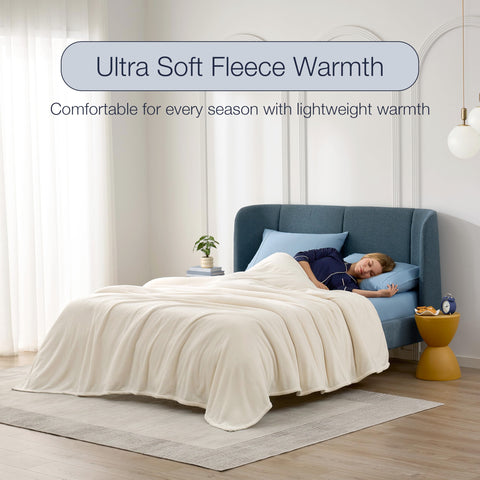 CASUAL LIVING blanket beside pillow illustrating scale and fit