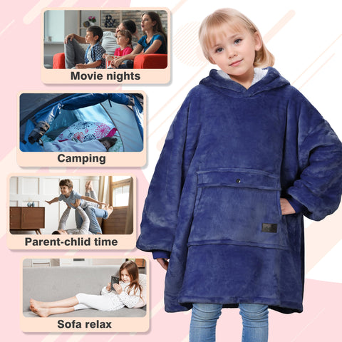 Catalonia child wearing the hoodie blanket beside a campfire for outdoor comfort