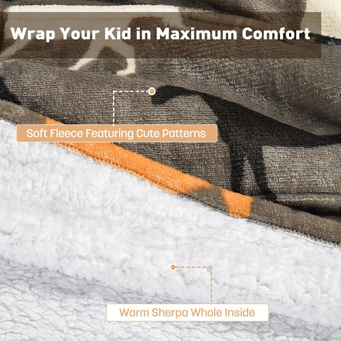 Catalonia child wearing the hoodie blanket reading, demonstrating cozy use