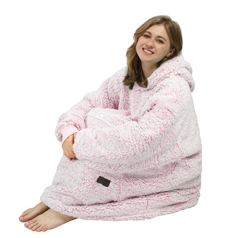 Person wearing Catalonia hoodie on couch showing relaxed wearability and lounging benefit