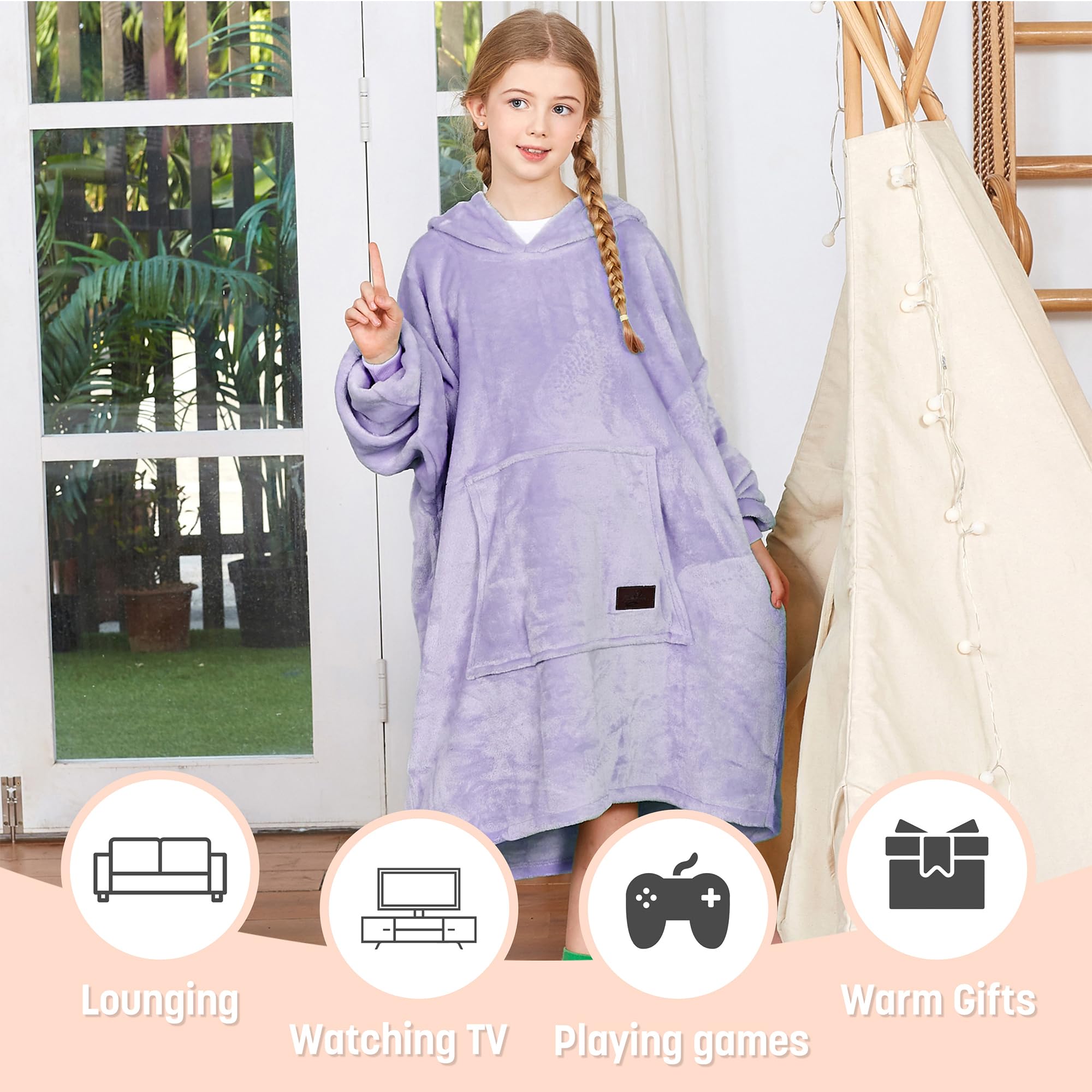 Catalonia child wearing oversized hoodie blanket in living room for cozy lifestyle use