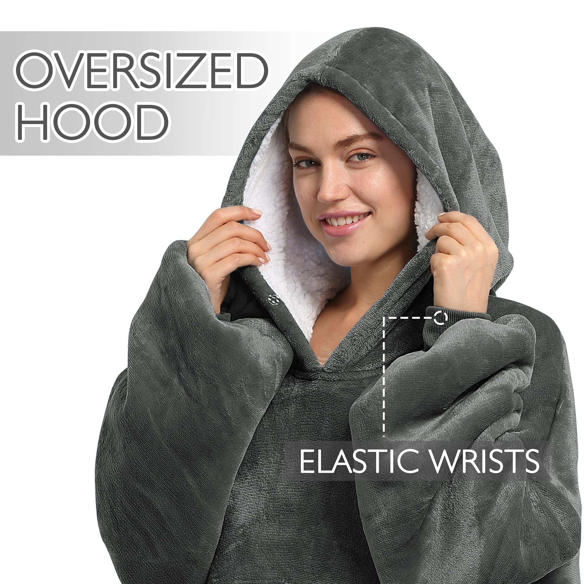 Catalonia lifestyle shot of model wearing hoodie blanket on sofa demonstrating comfy lounging