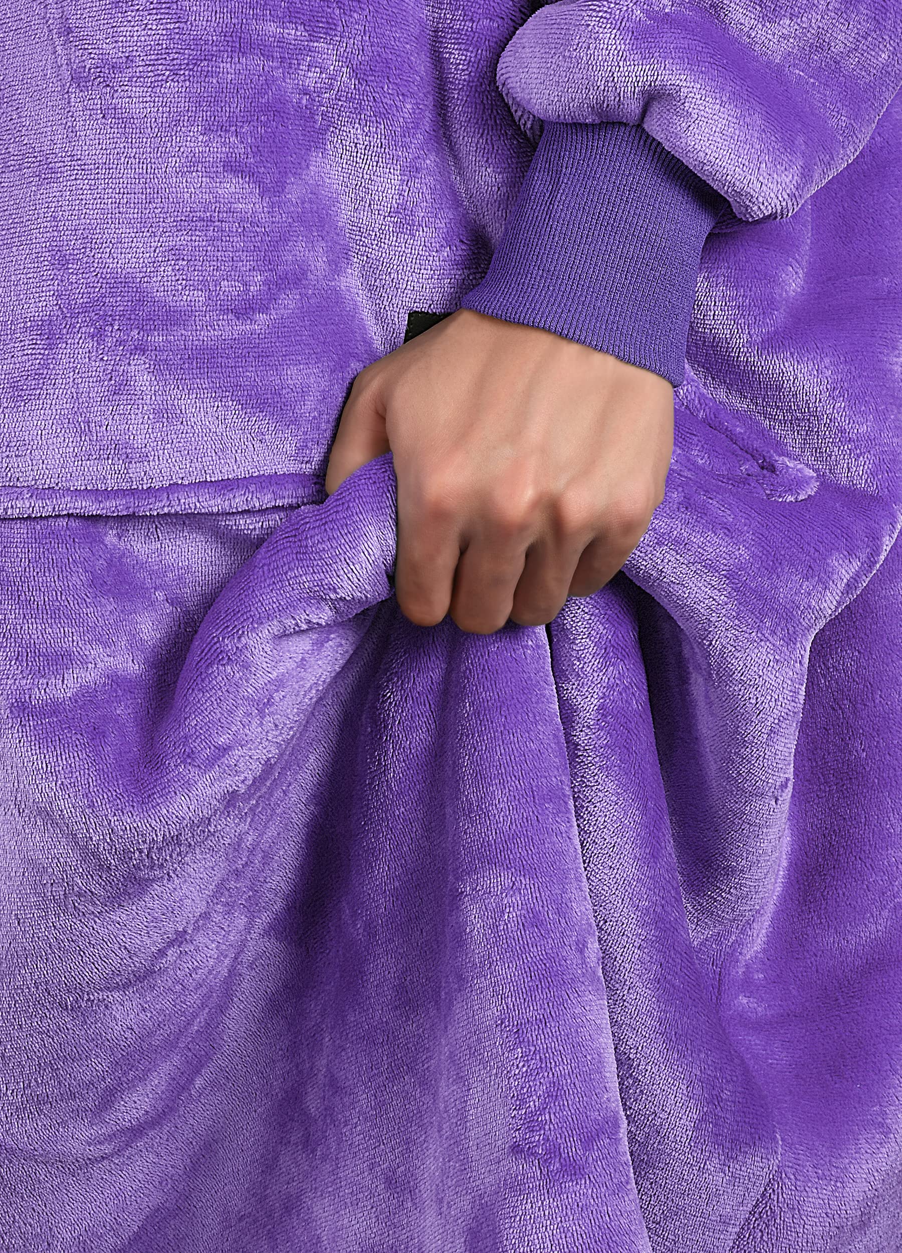 Catalonia wearable blanket on sofa lifestyle shot for relaxed at-home comfort
