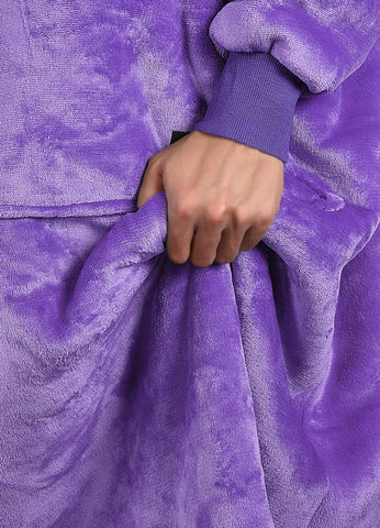 Catalonia wearable blanket on sofa lifestyle shot for relaxed at-home comfort