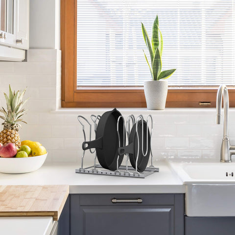 CAXXA holding cast iron and baking sheet to protect cookware edges