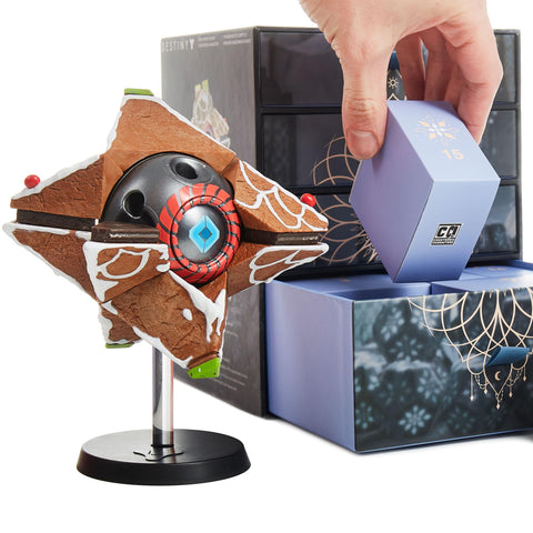 CC Countdown Characters assembled Ghost shell shown next to a hand for scale and shelf placement guidance