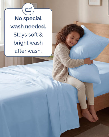 CGK Unlimited styled bedroom with light blue sheets creating inviting, cool-looking sleep space