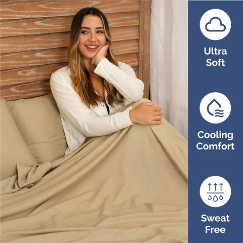CGK Unlimited styled bed in bedroom illustrating cool, neutral heathered tan for modern decor