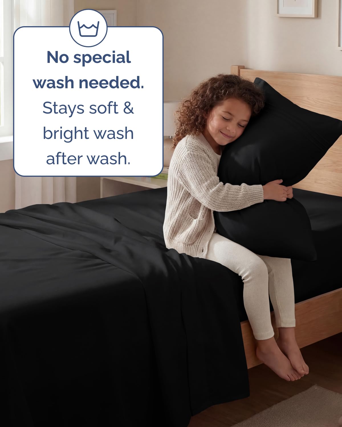 CGK Unlimited bedroom lifestyle with black sheets offering elegant comfort