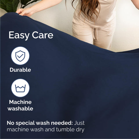 CGK Unlimited styled bedroom with navy sheets illustrating cooling aesthetic and mood