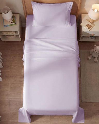CGK Unlimited styled bedroom with sheets offering inviting, cool comfort