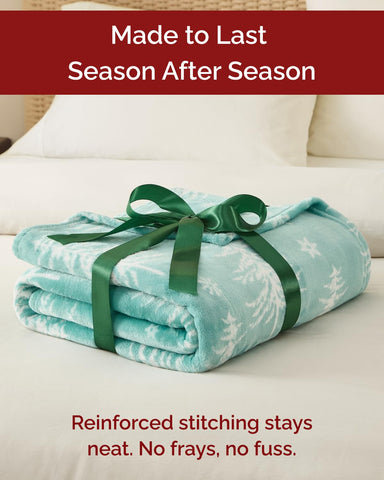 CGK Unlimited styled on a bed showing how the throw enhances holiday bedroom decor
