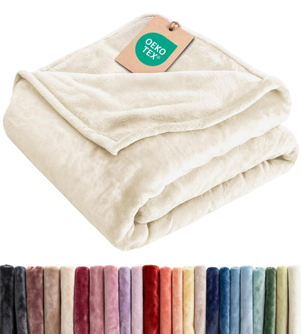 CGK Unlimited cream twin blanket front view showing plush softness and neutral color