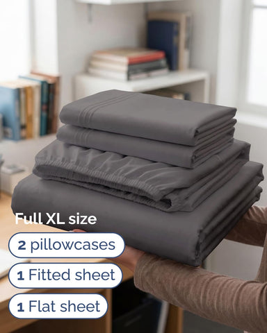 CGK Unlimited flat sheet fully spread on bed showing generous tuck-in allowance