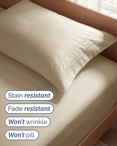 CGK Unlimited flat sheet spread on twin bed highlighting smooth drape