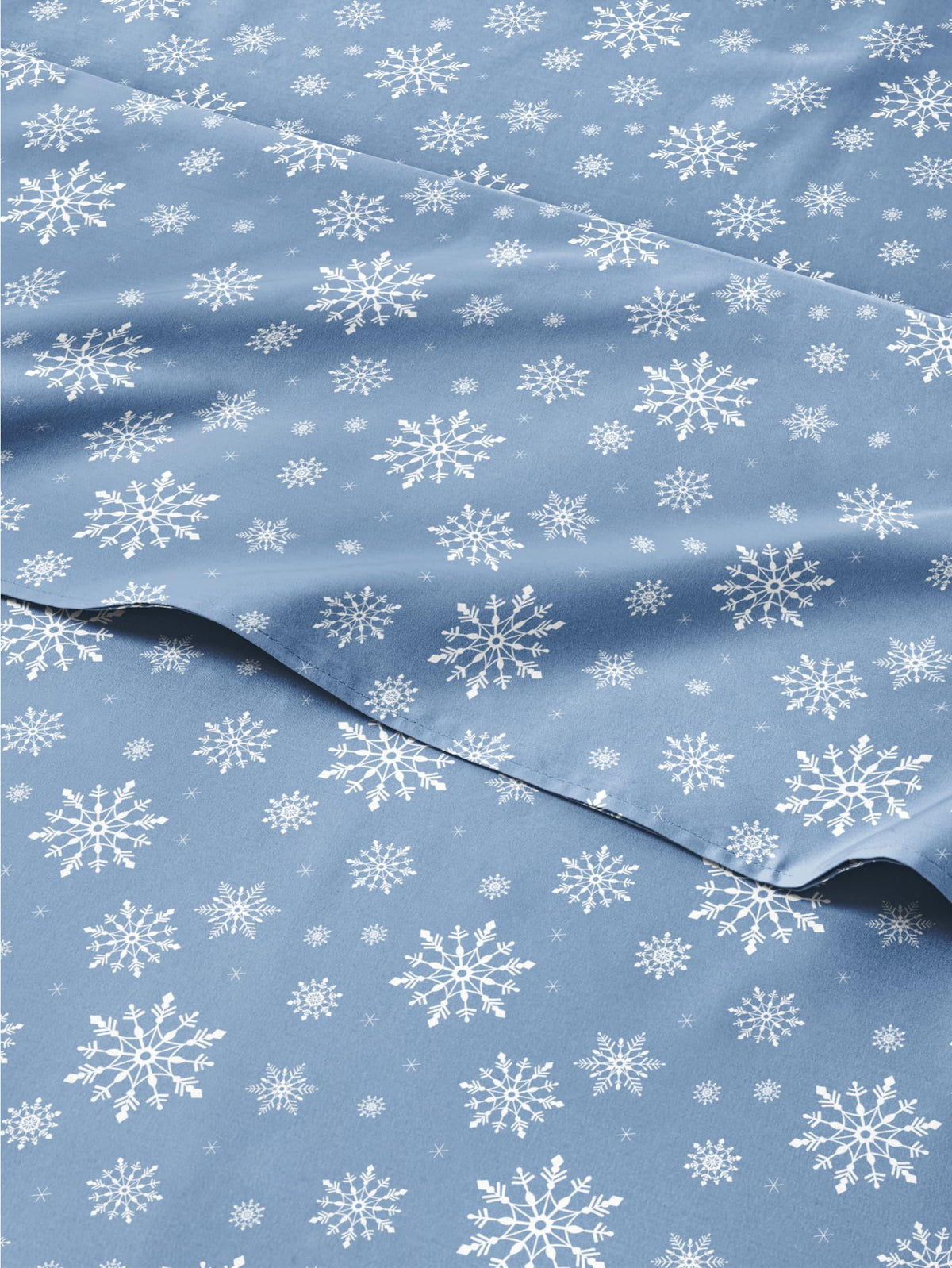 CGK Unlimited front view of boxed blue snowflakes sheet set showing festive design and soft look