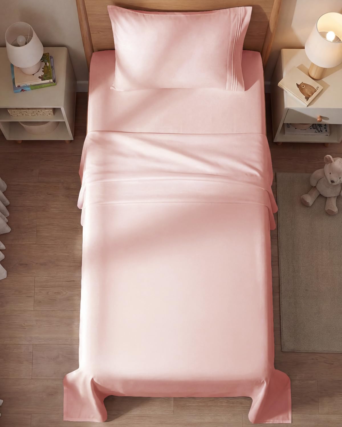 CGK Unlimited baby pink sheets styled on a tidy bedroom for a calming look