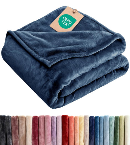 CGK Unlimited navy blanket front view showing neat hem and rich color, adds elegance