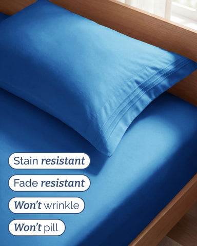 CGK Unlimited styled twin bed with sheets for a neat, inviting bedroom presentation