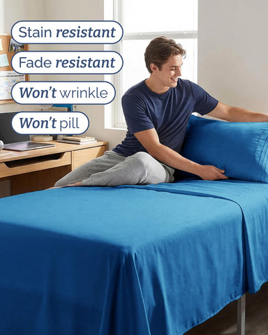 CGK Unlimited royal blue sheets arranged on a dorm bed showing cozy, home-like comfort