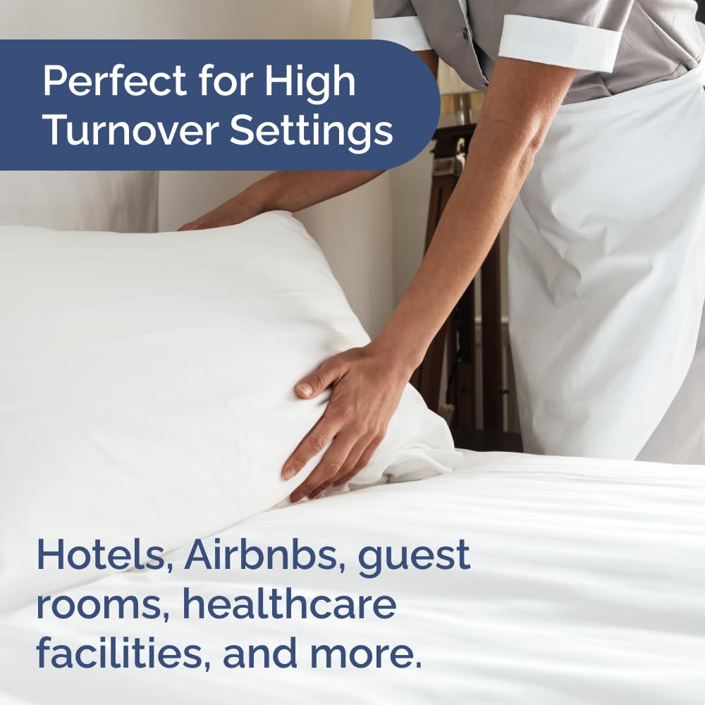 CGK Unlimited queen bed dressed with sheets to show neat fit and guest-ready look