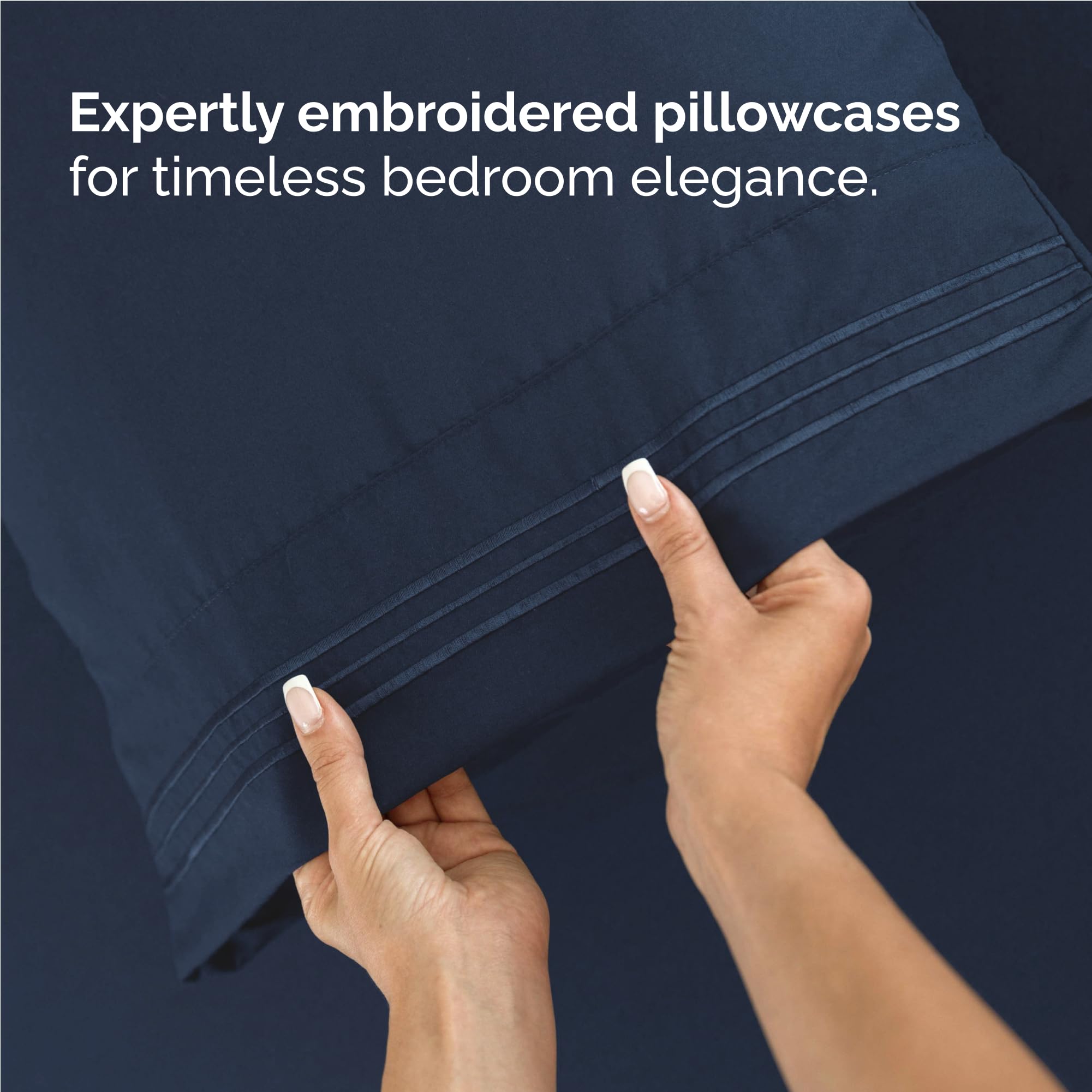 CGK Unlimited navy sheets styled in bedroom to show inviting, easy-to-care comfort