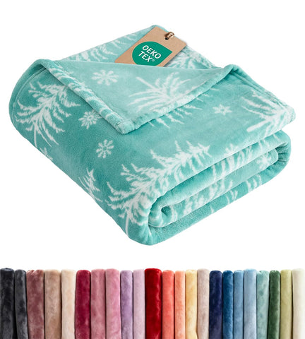CGK Unlimited front view of snowflake fleece blanket showing festive design and cozy appeal