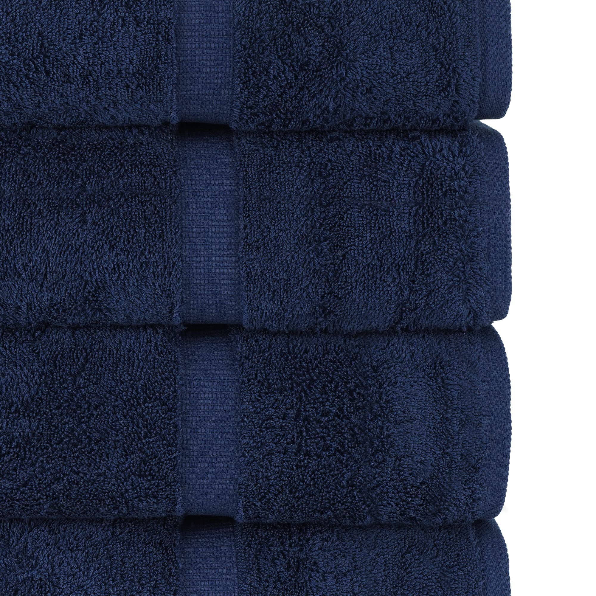 Chakir Turkish Linens folded stack on shelf conveying neat storage benefit
