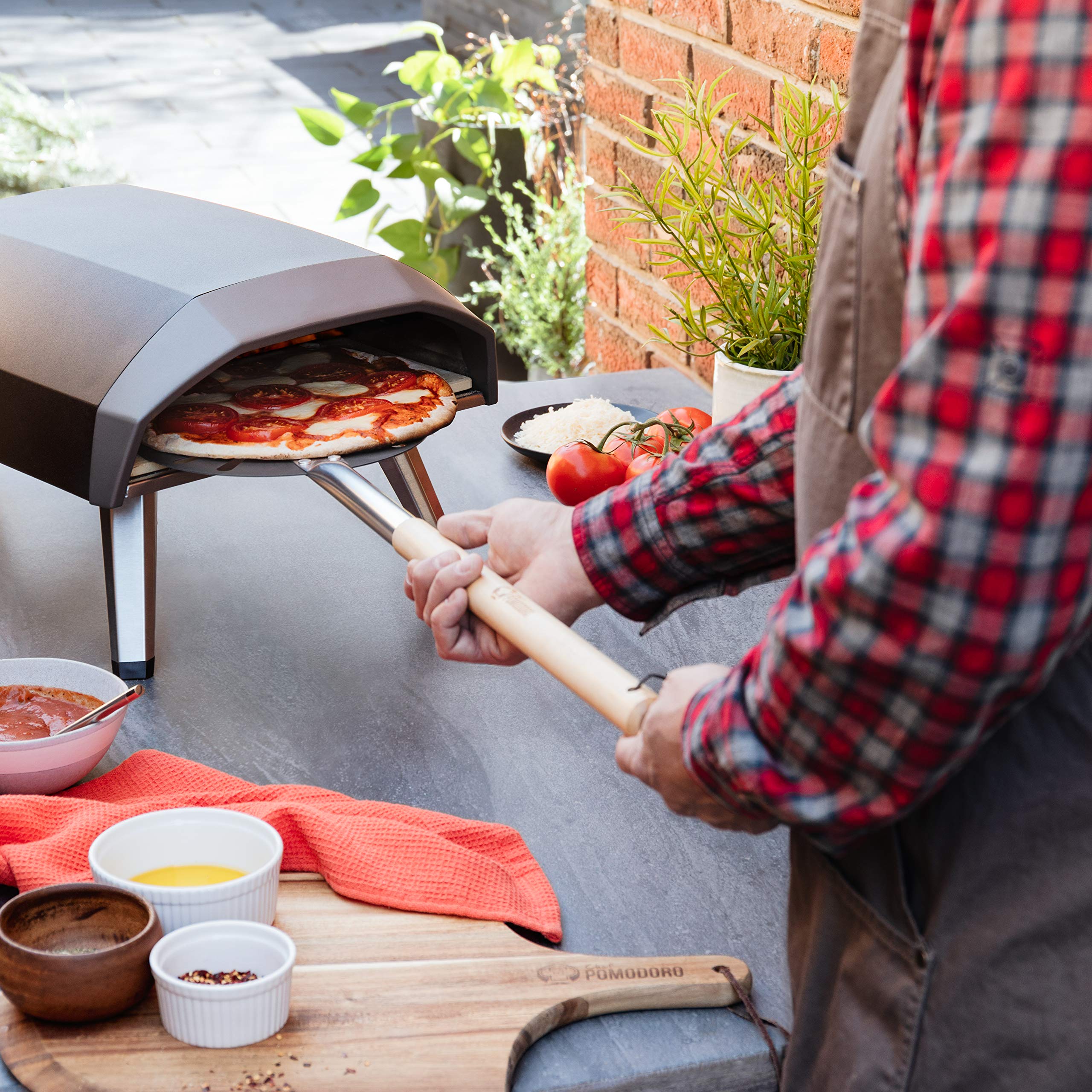 Chef Pomodoro in backyard oven scene highlighting professional-style results