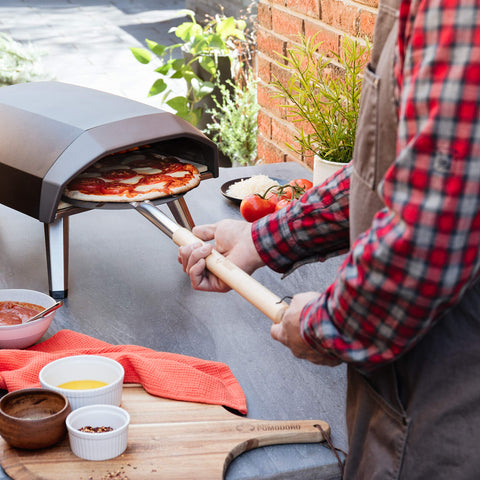 Chef Pomodoro in backyard oven scene highlighting professional-style results