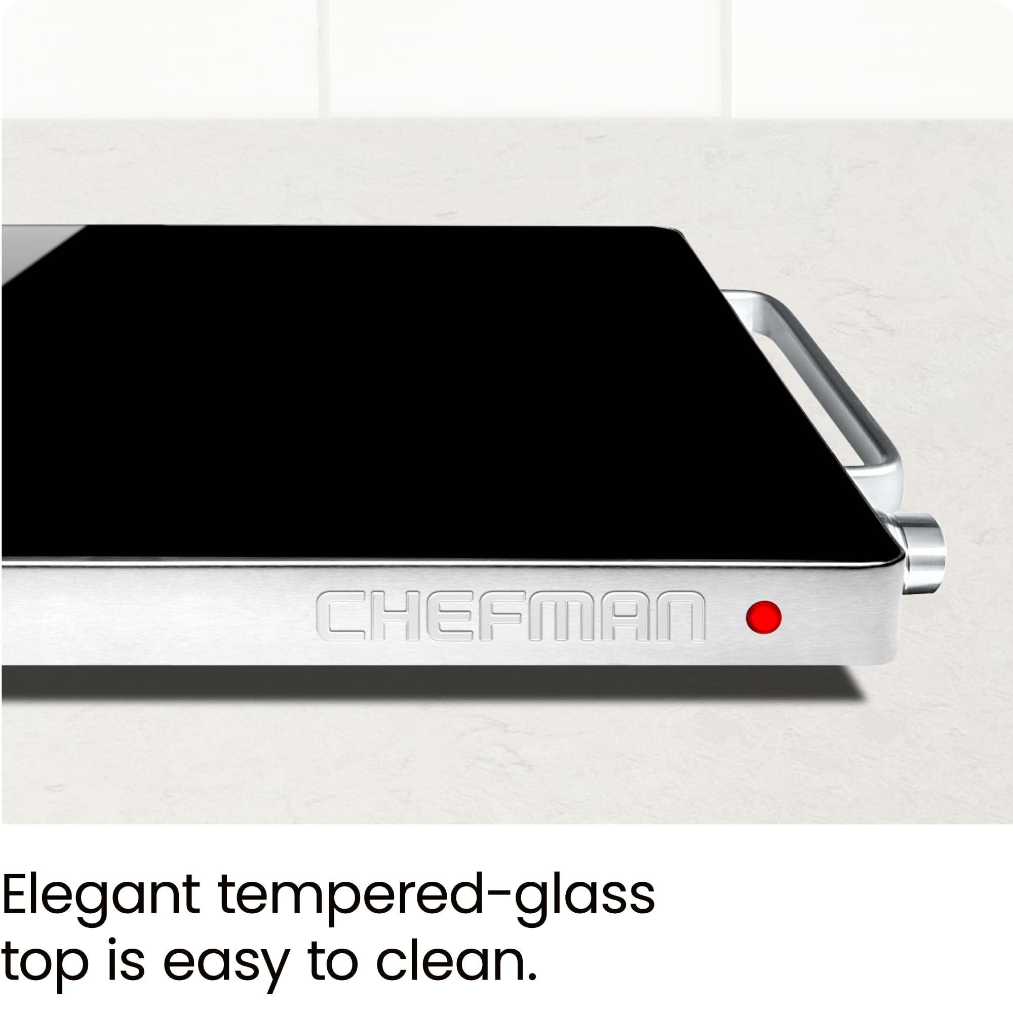Chefman cool-touch aluminum handles being held for safe transport and serving